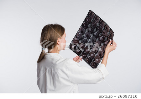 Female doctor examining an x-ray picture, back 26097310