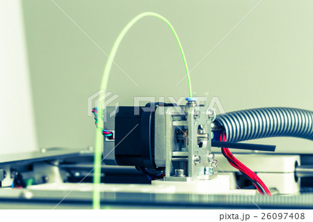 3d printer with bright green filament. 26097408