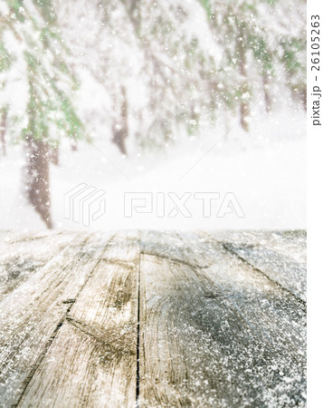 Wooden table in winter forest 26105263