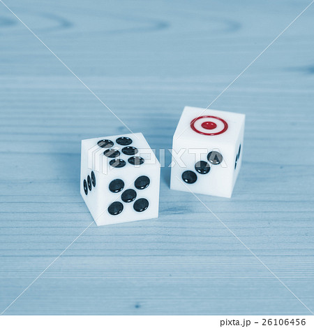 Two dices on wood table 26106456