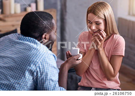Young man proposing marriage to his girlfriend 26106750