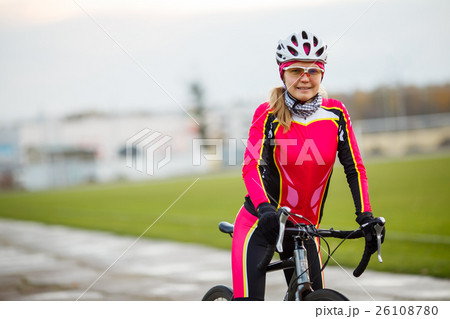 Young smiling athletic female cyclist in special Young smiling athletic female cyclist in special 26108780