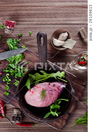 Pieces of fresh raw meat in a frying pan Pieces of fresh raw meat in a frying pan 26109815