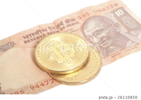 Golden  Bitcoin coins on Indian ten Rupee 26110850