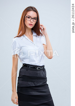 The smiling young business woman on gray  26113434