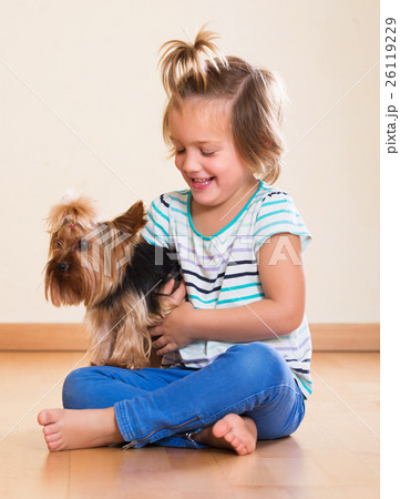 Little girl holding Yorkshire Terrier Little girl holding Yorkshire Terrier 26119229