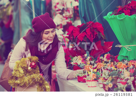 Young girl near counter with mistletoe Young girl near counter with mistletoe 26119381
