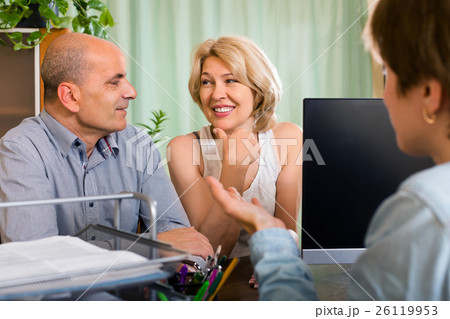 Public notary helping happy elderly couple to make a will Public notary helping happy elderly couple to make a will 26119953