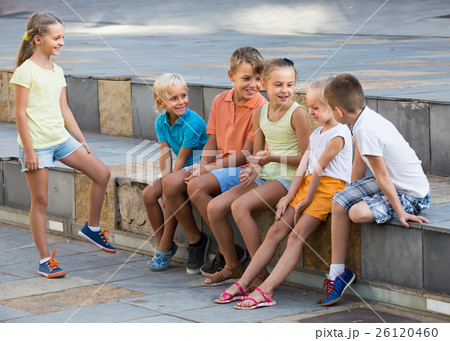 children playing charades outdoors 26120460