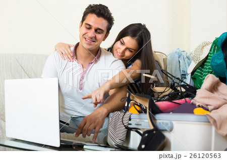 Couple with notebook and credit card. 26120563