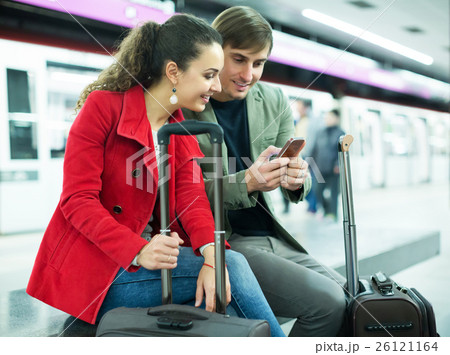 People reading news with phones People reading news with phones 26121164