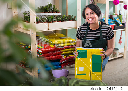 woman holding package withsoil woman holding package withsoil 26121194
