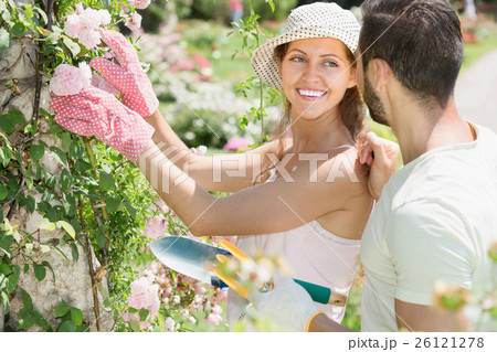 Girl in flowers garden with her boyfriend Girl in flowers garden with her boyfriend 26121278