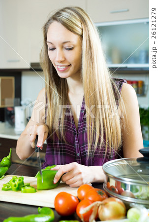 happy girl cooking with vegetables happy girl cooking with vegetables 26121279