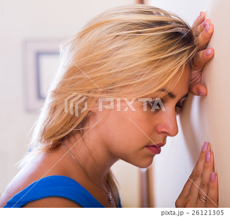 unhappy girl posing in interior 26121305