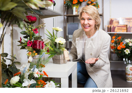 Mature female customer in floral shop. 26121692
