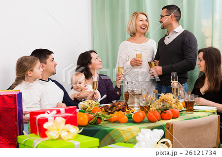 Older pair celebrating jubilee at festive table 26121734