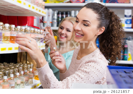 Portrait of young female customers shopping 26121857