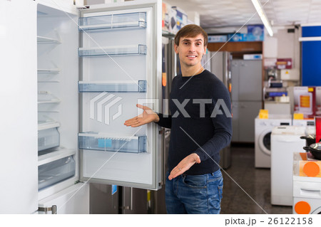 Man choosing new fridge 26122158