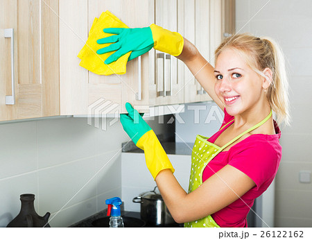Woman wiping surfaces indoors 26122162