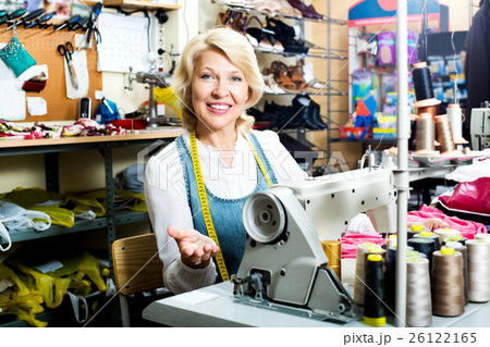 Mature woman sewing with professional machine 26122165