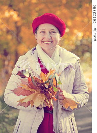 happy mature woman in autumn happy mature woman in autumn 26122396