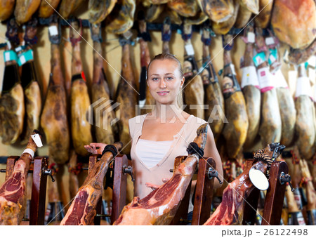Woman picking delicious prosciutto meat Woman picking delicious prosciutto meat 26122498