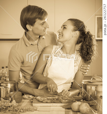 family couple cooking vegetables family couple cooking vegetables 26122757