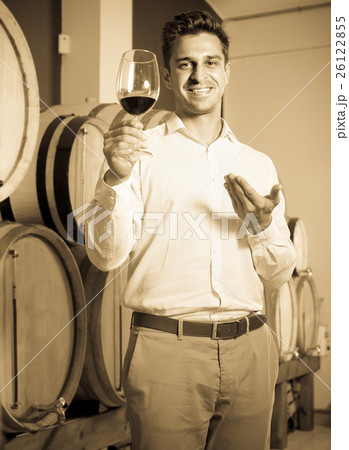 man tasting wine in cellar man tasting wine in cellar 26122855