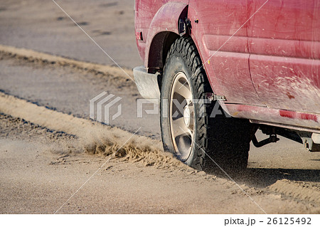 offroad car tire detail on sand beach offroad car tire detail on sand beach 26125492