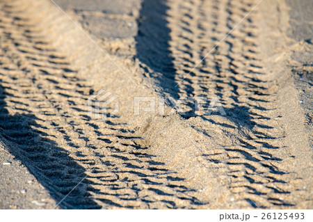 offroad car tire  track detail on sand beach 26125493