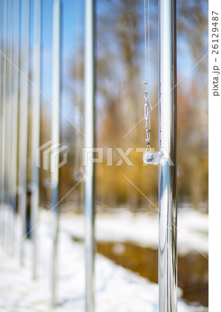 Row of flagpoles without flags 26129487