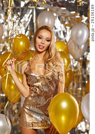 portrait of blond young woman between golden 26136189