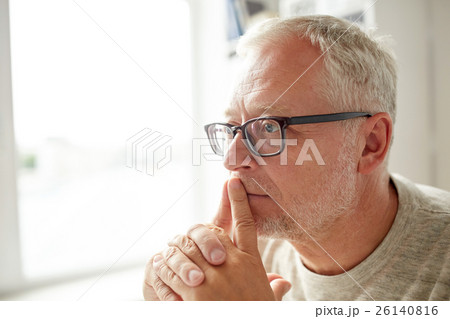 close up of senior man in glasses thinking 26140816