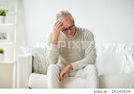 senior man suffering from headache at home senior man suffering from headache at home 26140826