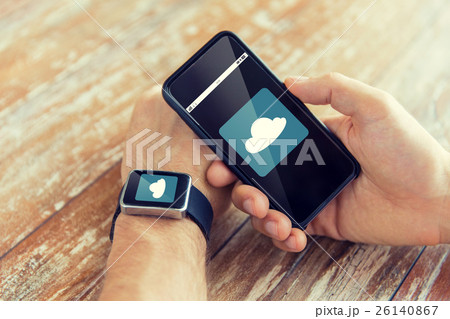 close up of hands with smart phone and watch close up of hands with smart phone and watch 26140867