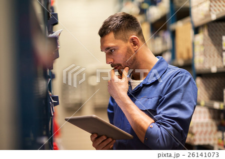 auto mechanic or smith with tablet pc at workshop auto mechanic or smith with tablet pc at workshop 26141073