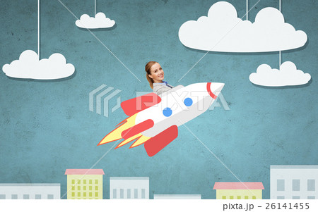 businesswoman flying on rocket above cartoon city 26141455