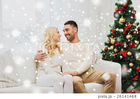 happy couple at home with christmas tree 26141468