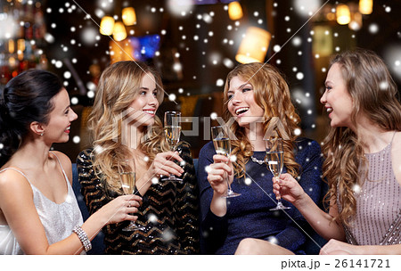 happy women with champagne glasses at night club 26141721