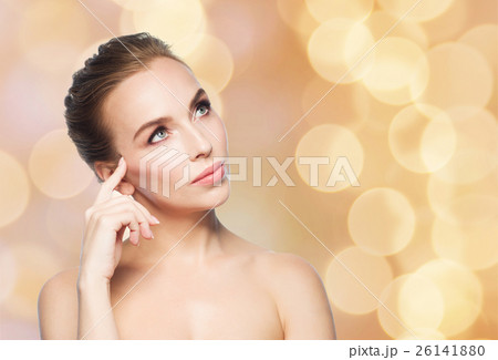 beautiful woman looking up over holidays lights beautiful woman looking up over holidays lights 26141880