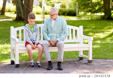 grandfather and grandson talking at summer park grandfather and grandson talking at summer park 26142378