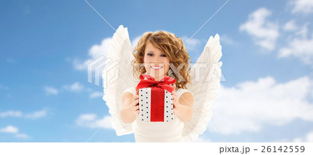 happy young woman with angel wings and gift box happy young woman with angel wings and gift box 26142559