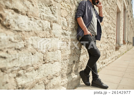 close up of man calling on smartphone in city close up of man calling on smartphone in city 26142977