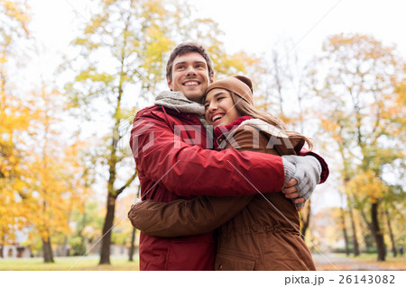 happy young couple hugging in autumn park happy young couple hugging in autumn park 26143082