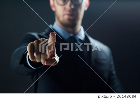 close up of businessman touching virtual screen 26143084