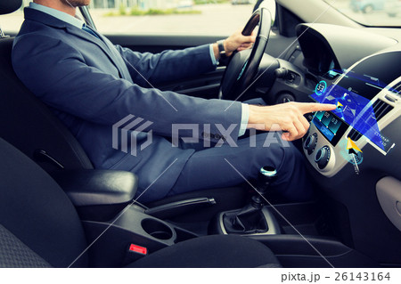 close up of man driving car with navigation close up of man driving car with navigation 26143164