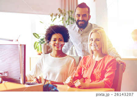 happy creative team with computer in office 26143207