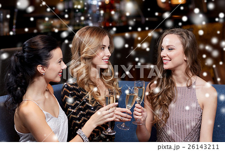 happy women with champagne glasses at night club 26143211