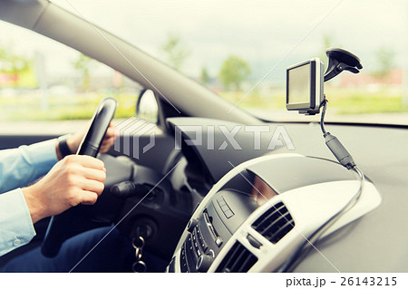 close up of man with gps navigator driving car 26143215
